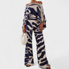 Audi | Schulterfreies Oberteil und Hose mit weitem Bein und frechem Print