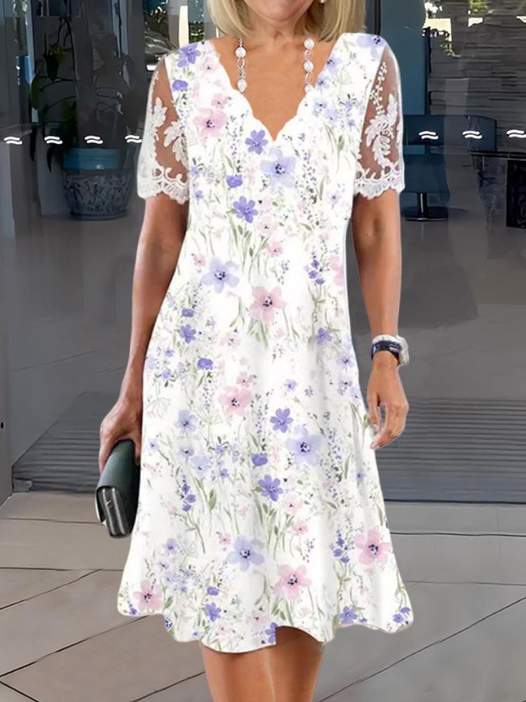 Jenice | Ätherisches Midikleid mit Blumendruck und transparenten Ärmeln